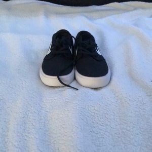 All black with white Nike swoosh.